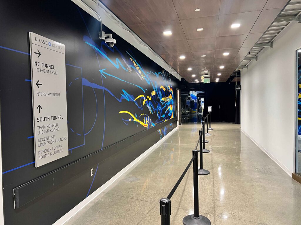 Environmental graphics and branded wall installation inside Intuit Dome.