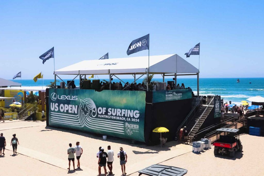 Large-format event graphics and branded hospitality structures for the Lexus US Open of Surfing.