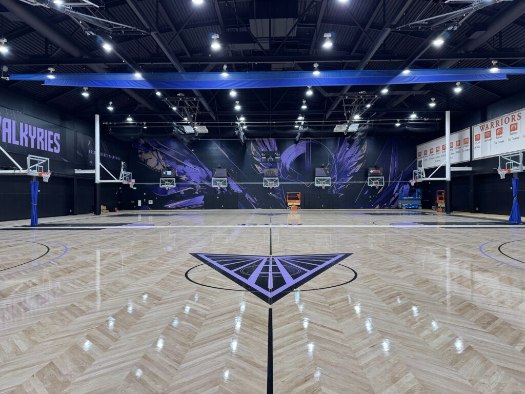 Branded environmental floor graphics installed inside the Golden State Valkyries performance facility.